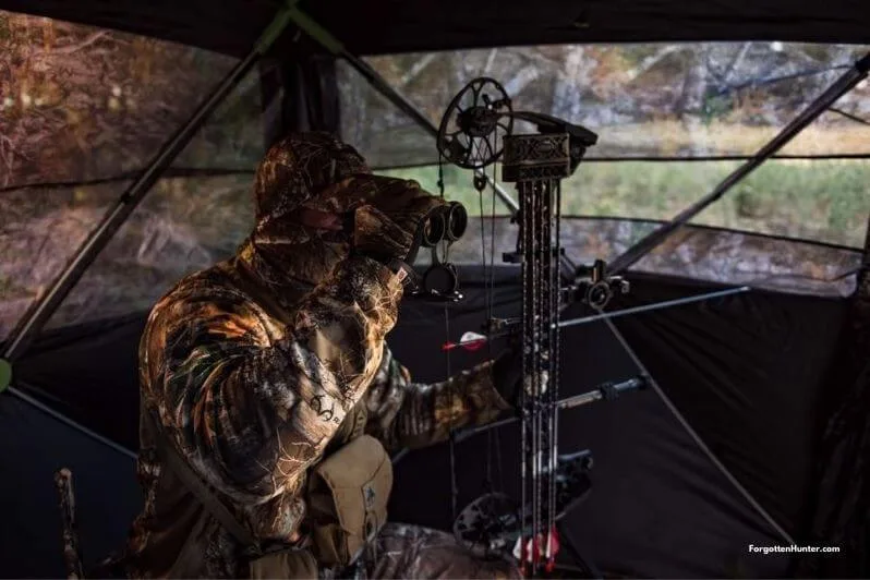 The Best Tree Stands for 2022 (Climbing/Hang On/Ladder) - Buyer's Guide 31 A Hunter hunting from a ground blind